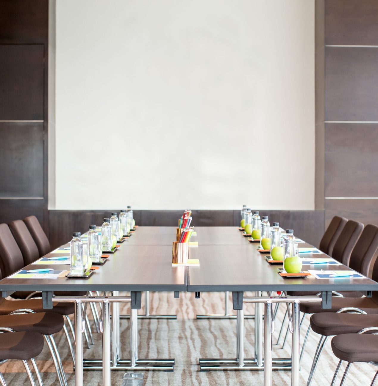 empty meeting room with table and whiteboard