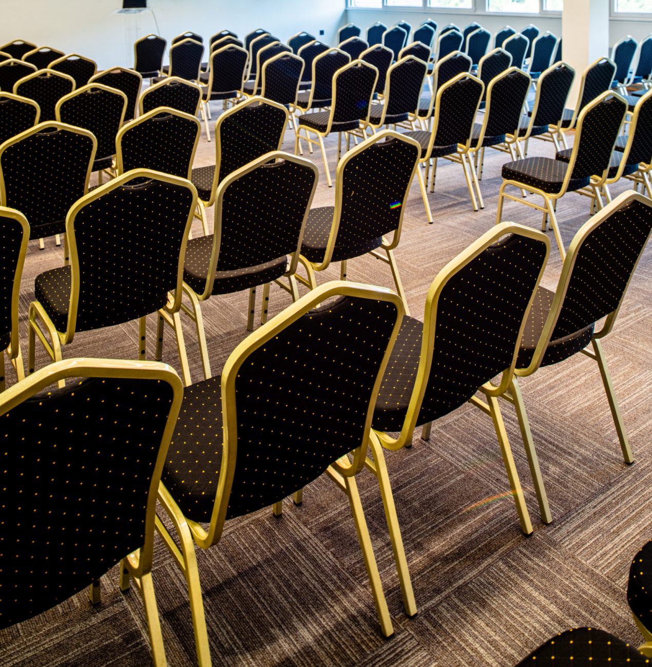 rear view of empty seats in convention center.
